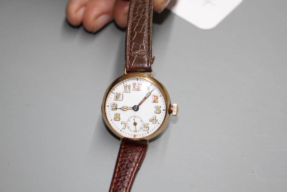A gentlemans 1920s 9ct. gold manual wind wristwatch, with case back inscription.